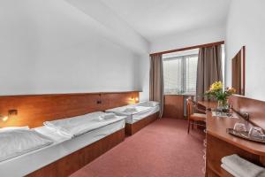 Postel nebo postele na pokoji v ubytování Abitohotel