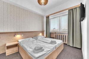 Postel nebo postele na pokoji v ubytování Abitohotel