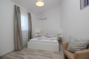 Postel nebo postele na pokoji v ubytování Apartments Lavanda - Kricin
