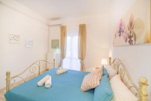 Кровать или кровати в номере Karia Holiday Home
