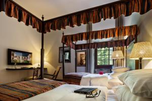 Cama ou camas em um quarto em Pousada Mosteiro de Guimaraes