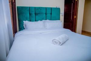 Ένα ή περισσότερα κρεβάτια σε δωμάτιο στο Jama Cosy Homes