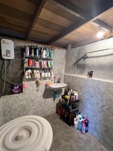 a bathroom with a sink and a toilet at Smiley Bungalows Guesthouse in Srithanu