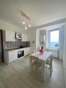 Кухня или мини-кухня в Casa Vacanze Merletto

