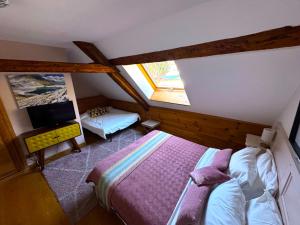 Postel nebo postele na pokoji v ubytování Chambre d'Hôtes La Grange des Ecrins
