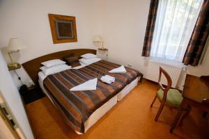 Posteľ alebo postele v izbe v ubytovaní Bernadett Villa Apartman 3