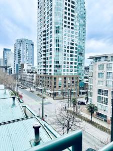 a view of a city with tall buildings at Luxury condo beach side Yaletown in Vancouver