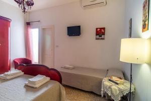 Posteľ alebo postele v izbe v ubytovaní Kalimera Home