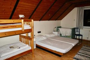 Postel nebo postele na pokoji v ubytování Vakantiehuis Reuzengebergte