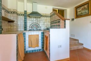a kitchen with a sink and a counter top at Etrusco in Roccastrada