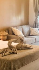 Letto o letti in una camera di Kay Pampa