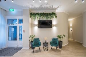TV a/nebo společenská místnost v ubytování Baross City Hotel - Budapest
