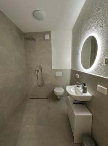 Koupelna v ubytování Bauna Suites & Apartments