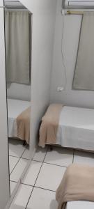 Postel nebo postele na pokoji v ubytování Hotel Andorinha