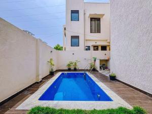 a swimming pool in the backyard of a house at Private 3BHK Villa with Indoor Pool in Chengalpattu