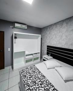 Postel nebo postele na pokoji v ubytování Papagaio Hotel