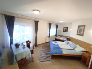 Postel nebo postele na pokoji v ubytování Chata penzion Zuberec