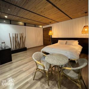 Postel nebo postele na pokoji v ubytování Glamping Los Turpiales