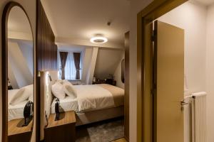 Krevet ili kreveti u jedinici u okviru objekta Deluxe Appart & Hotel Zürich Kreis 4