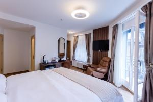 Krevet ili kreveti u jedinici u okviru objekta Deluxe Appart & Hotel Zürich Kreis 4