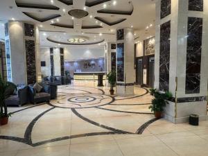 a lobby with a spiral design on the floor at Maysan Al Safa Hotel in Mecca