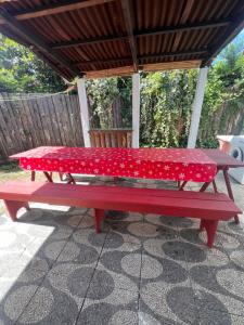 a red picnic table sitting on a patio at CaSaBELLa in La Floresta