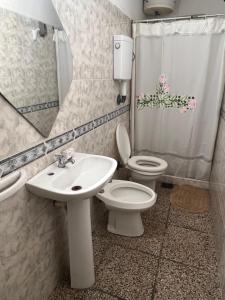 a bathroom with a sink and a toilet and a shower at CaSaBELLa in La Floresta