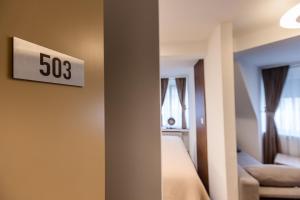 Krevet ili kreveti u jedinici u okviru objekta Deluxe Appart & Hotel Zürich Kreis 4