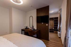 Krevet ili kreveti u jedinici u okviru objekta Deluxe Appart & Hotel Zürich Kreis 4