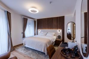 Krevet ili kreveti u jedinici u okviru objekta Deluxe Appart & Hotel Zürich Kreis 4