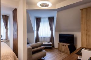 TV i/ili multimedijalni sistem u objektu Deluxe Appart & Hotel Zürich Kreis 4