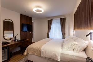 Krevet ili kreveti u jedinici u okviru objekta Deluxe Appart & Hotel Zürich Kreis 4