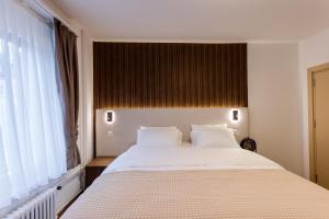 Krevet ili kreveti u jedinici u okviru objekta Deluxe Appart & Hotel Zürich Kreis 4