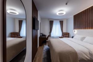 Krevet ili kreveti u jedinici u okviru objekta Deluxe Appart & Hotel Zürich Kreis 4