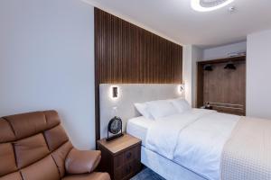 Krevet ili kreveti u jedinici u okviru objekta Deluxe Appart & Hotel Zürich Kreis 4