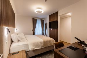Krevet ili kreveti u jedinici u okviru objekta Deluxe Appart & Hotel Zürich Kreis 4