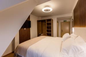 Krevet ili kreveti u jedinici u okviru objekta Deluxe Appart & Hotel Zürich Kreis 4