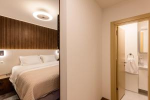 Krevet ili kreveti u jedinici u okviru objekta Deluxe Appart & Hotel Zürich Kreis 4
