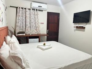 Cama ou camas em um quarto em Pousada Paraíso dos Milagres