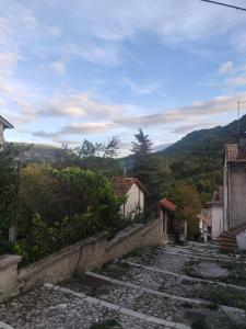 an old stone path leading up to some houses at Italia Highland Retreat in Abruzzo in Verrecchie