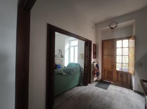 a room with a mirror and a room with a door at Italia Highland Retreat in Abruzzo in Verrecchie