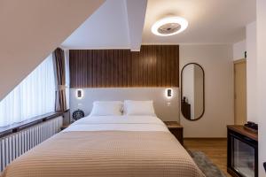 Krevet ili kreveti u jedinici u okviru objekta Deluxe Appart & Hotel Zürich Kreis 4