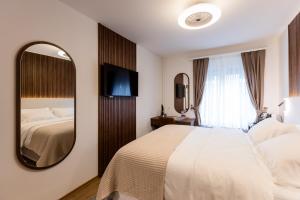 Krevet ili kreveti u jedinici u okviru objekta Deluxe Appart & Hotel Zürich Kreis 4