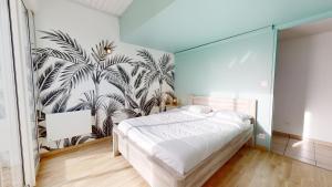 Postel nebo postele na pokoji v ubytování Le Chant des Vagues