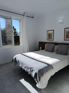 a bedroom with a large bed and a window at Vera Natura Apartamento Roci in Vera +32 photos