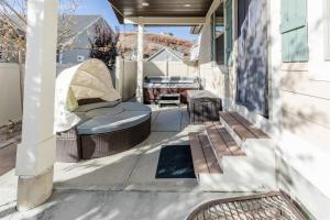 a patio with a bench and a table on a house at Bear Lake Bungalow in Garden City