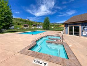 a swimming pool in the middle of a patio at Bear Lake Bungalow in Garden City