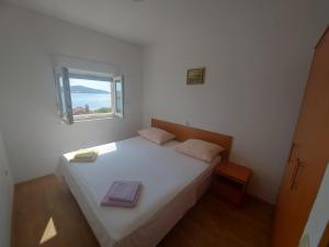Postel nebo postele na pokoji v ubytování Apartments Pisac