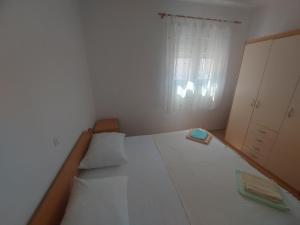 Postel nebo postele na pokoji v ubytování Apartments Pisac
