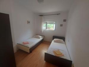 Postel nebo postele na pokoji v ubytování Apartments Pisac